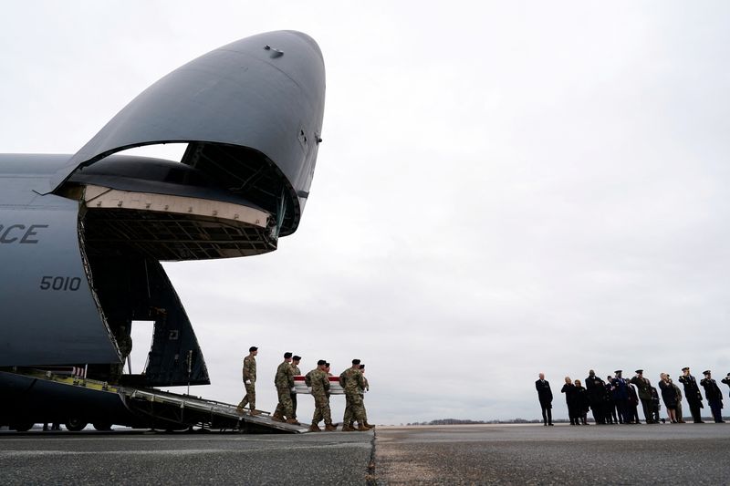 © Reuters. FILE PHOTO: U.S. President Joe Biden, first lady Jill Biden, Secretary of Defense Lloyd J. Austin III and Chairman of the Joint Chiefs of Staff and Air Force General Charles Q. Brown attend the dignified transfer of the remains of Army Reserve Sergeants William Rivers, Kennedy Sanders and Breonna Moffett, three U.S. service members who were killed in Jordan during a drone attack carried out by Iran-backed militants, at Dover Air Force Base in Dover, Delaware, U.S., February 2, 2024. REUTERS/Joshua Roberts/File Photo 