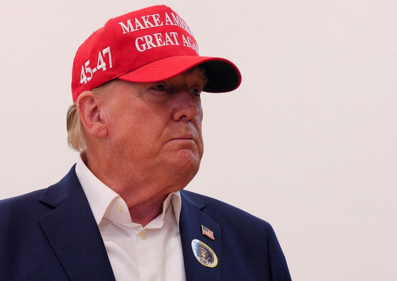 &copy; Reuters. FILE PHOTO: Republican presidential nominee and former U.S. President Donald Trump wears an "I Voted" sticker as he speaks to reporters after voting at Mandel Recreation Center on Election Day in Palm Beach, Florida, U.S., November 5, 2024. REUTERS/Brian 