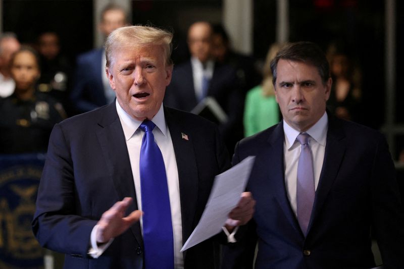 © Reuters. FILE PHOTO: Former US President Donald Trump, alongside his lawyer Todd Blanche, speaks to the media as he arrives at his criminal trial for allegedly hiding secret money payments at Manhattan Criminal Court on May 30, 2024 in New York. Michael M. Santiago/Pool via REUTERS/File Photo