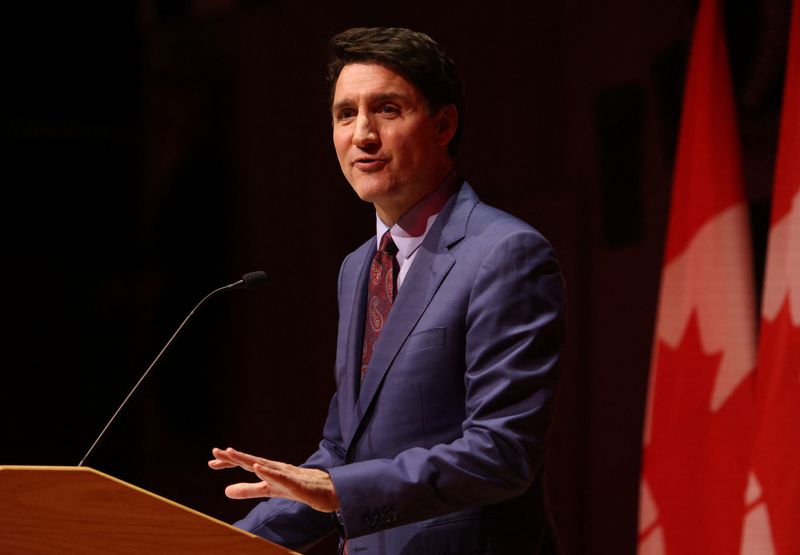 © Reuters. FILE PHOTO: Canada's Prime Minister Justin Trudeau speaks at the Laurier Club holiday party in Gatineau, Quebec, Canada, December 16, 2024.  REUTERS/Patrick Doyle/File Photo