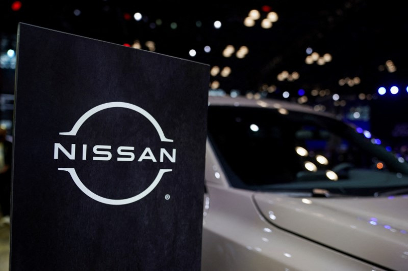 © Reuters. FILE PHOTO: A Nissan logo is seen next to a vehicle during the New York International Auto Show, in Manhattan, New York City, U.S., April 5, 2023. REUTERS/David 'Dee' Delgado/File Photo