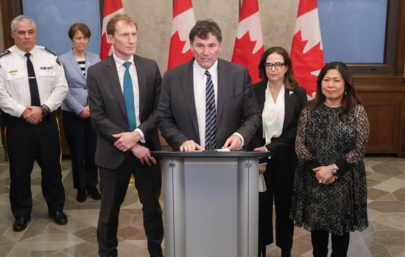 © Reuters. Canada's Public Safety and Finance Minister Dominic LeBlanc speaks at a press conference about the government's border plan as Royal Canadian Mounted Police (RCMP) Commissioner Mike Duheme, President of the Canada Border Services Agency (CBSA) Erin O'Gorman, Minister of Immigration, Refugees and Citizenship Marc Miller, Mental Health and Addictions Minister Ya'ara Saks, and Export Promotion, International Trade and Economic Development Minister Mary Ng listen, on Parliament Hill in Ottawa, Ontario, Canada, December 17, 2024.  REUTERS/Patrick Doyle