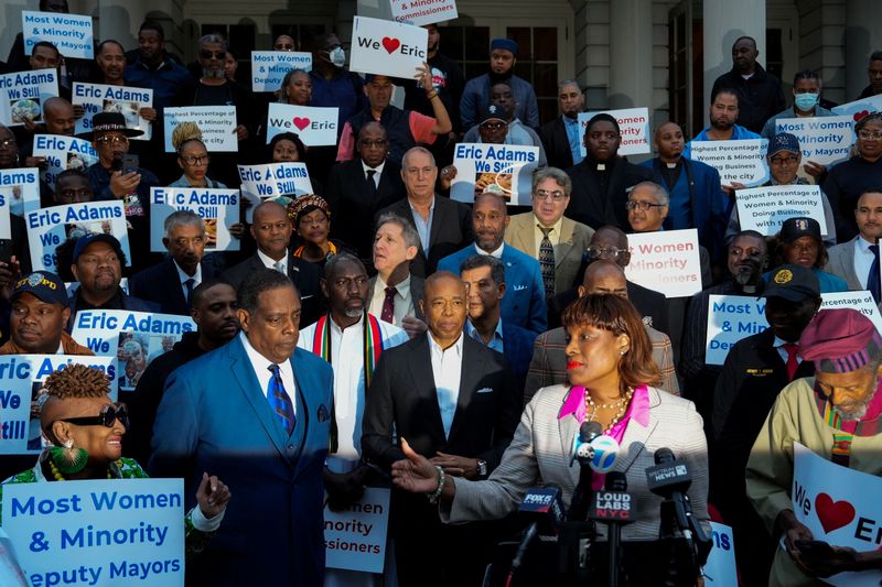 © Reuters. FILE PHOTO: New York City Mayor Eric Adams listens as his Chief Advisor Ingrid Lewis-Martin speaks at a prayer rally held for him outside of City Hall in New York City, U.S., October 1, 2024. REUTERS/Adam Gray/FIle photo