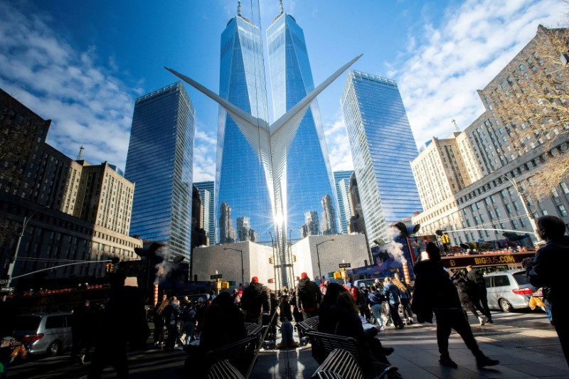 &copy; Reuters. FILE PHOTO: People walk around the Financial District near the New York Stock Exchange (NYSE) in New York, U.S., December 29, 2023. REUTERS/Eduardo Munoz/File Photo