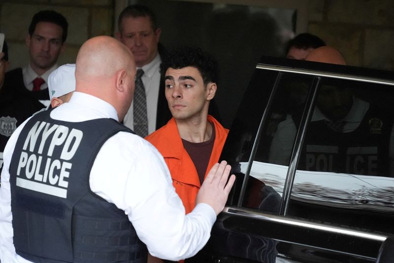 © Reuters. Luigi Nicholas Mangione leaves at Blair County Courthouse in Hollidaysburg, Pennsylvania U.S., Thursday, Dec. 19, 2024.     Gene J. Puskar/Pool via REUTERS   