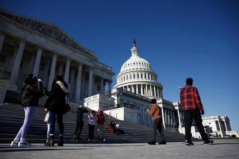 &copy; Reuters. FILE PHOTO: People walk near the U.S. Capitol in Washington, D.C., U.S., December 2, 2024. REUTERS/Benoit Tessier/File Photo