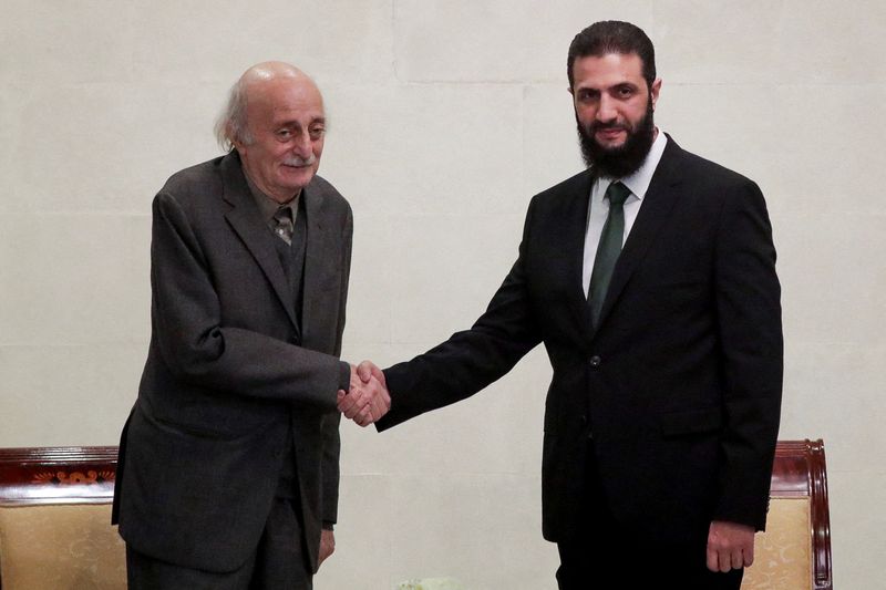 © Reuters. Lebanese Druze leader Walid Jumblatt shakes hands with de facto Syrian leader Ahmed al-Sharaa in Damascus, Syria, December 22, 2024. Photograph: Khalil Ashawi - Reuters. 