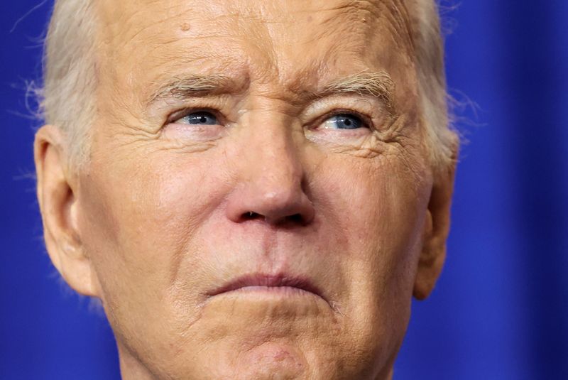 © Reuters. FILE PHOTO: U.S. President Joe Biden looks on as he visits the Department of Labor for an event honoring the nation's labor history and Frances Perkins, longest serving U.S Secretary of Labor, in Washington, U.S., December 16, 2024. REUTERS/Kevin Lamarque/File Photo