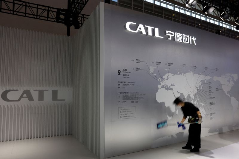 &copy; Reuters. FILE PHOTO: A staff member cleans a display showing the locations of battery maker CATL's production bases, at the CATL booth during the first China International Supply Chain Expo (CISCE) in Beijing, China November 28, 2023. REUTERS/Florence Lo/File Phot