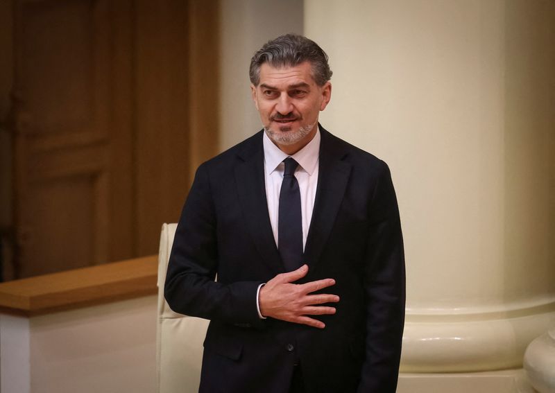 © Reuters. FILE PHOTO: Mikheil Kavelashvili reacts after being elected the country's new president in Parliament, in Tbilisi, Georgia on December 14, 2024. REUTERS/Irakli Gedenidze/File Photo