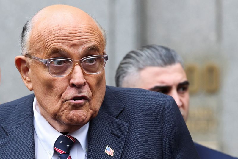 &copy; Reuters. FILE PHOTO: Former Donald Trump lawyer and former New York City Mayor Rudolph Giuliani speaks to the media as he departs the U.S. Federal court following a hearing in his case to surrender valuables to Georgia election workers he was found to have defamed