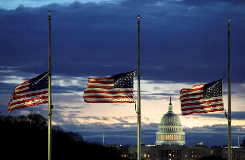 &copy; Reuters. FILE PHOTO: With the U.S. Capitol in the distance, flags fly at half-staff at the Washington Monument on the National Mall following the death of former U.S. President Jimmy Carter, in Washington, U.S., December 30, 2024.  REUTERS/Kevin Lamarque/File Phot