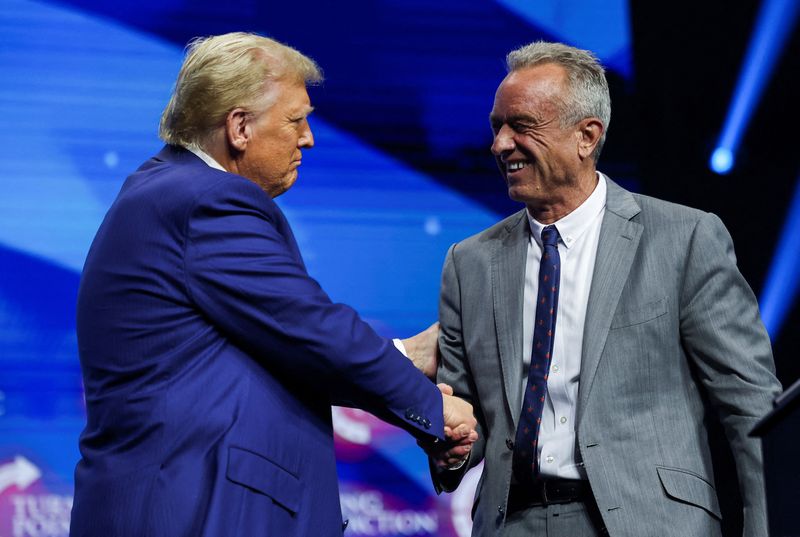 &copy; Reuters. FILE PHOTO: Robert F. Kennedy Jr. and Republican presidential nominee and former U.S. President Donald Trump greet each other at a campaign event sponsored by conservative group Turning Point USA, in Duluth, Georgia, U.S., October 23, 2024. REUTERS/Carlos