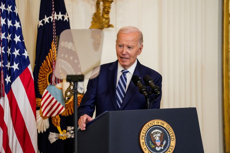 © Reuters. US President Joe Biden delivers a speech as he attends the bill signing ceremony 