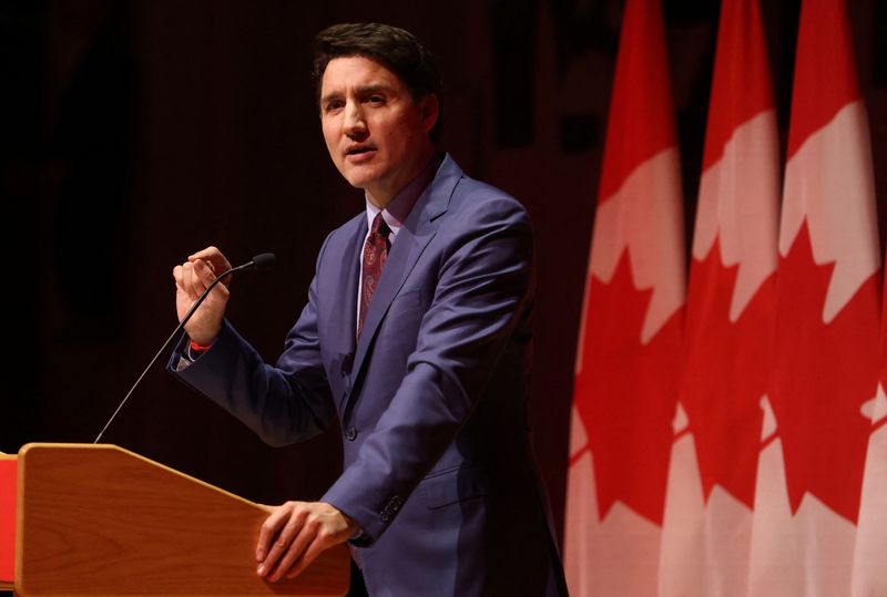 © Reuters. FILE PHOTO: Canadian Prime Minister Justin Trudeau speaks at a Laurier Club holiday party in Gatineau, Quebec, Canada, December 16, 2024. REUTERS/Patrick Doyle/File Photo