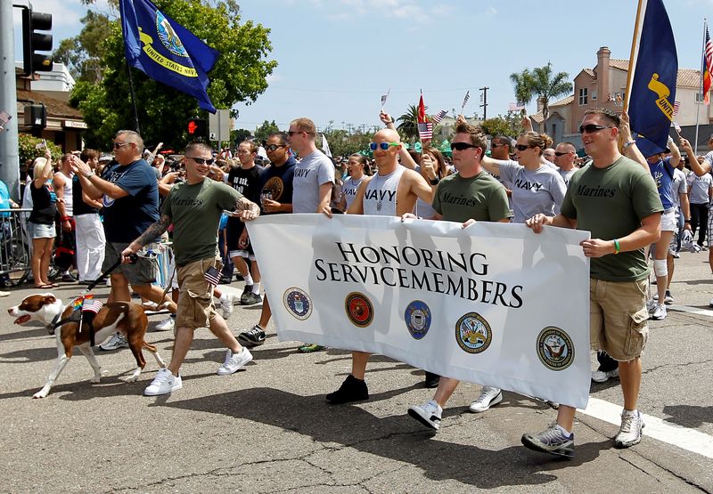 © Reuters. FILE PHOTO: Active and non-active U.S. military personnel participate for the first time in San Diego's Gay Pride Parade in San Diego, July 16, 2011. The group is reported to be the first openly gay enlisted service members to march in a pride event in the United States following Congress repeal of the 