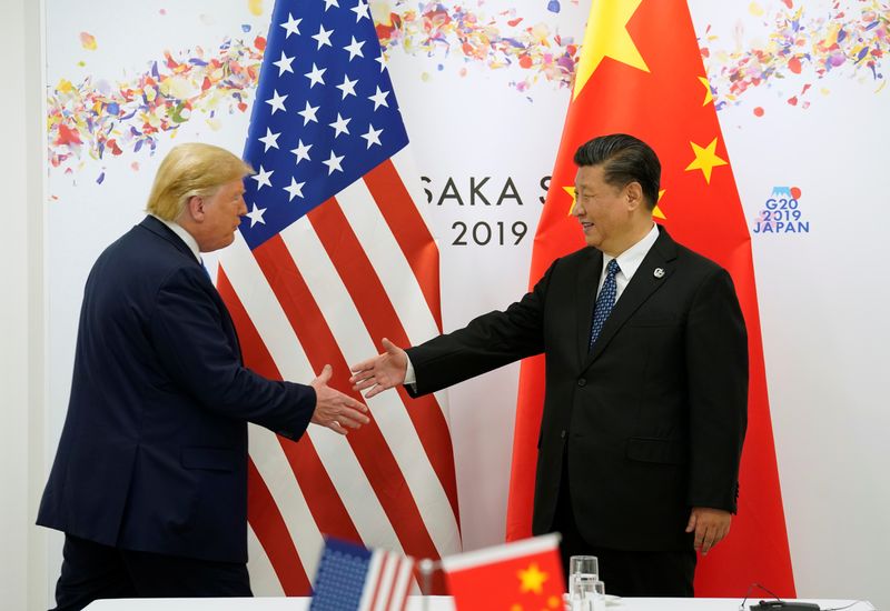 © Reuters. FILE PHOTO: U.S. President Donald Trump and China's President Xi Jinping shake hands before their bilateral meeting during the G20 leaders summit in Osaka, Japan, June 29, 2019. REUTERS/Kevin Lamarque/File Photo