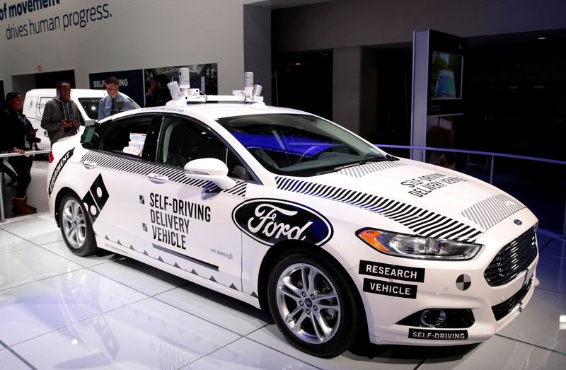 &copy; Reuters. FILE PHOTO: A Ford Fusion hybrid, Level 4 autonomous vehicle, used by Ford Motor and Domino's Pizza to test a self-driving pizza delivery car in Michigan, is displayed during Press Days of the North American International Auto Show at Cobo Center in Detro