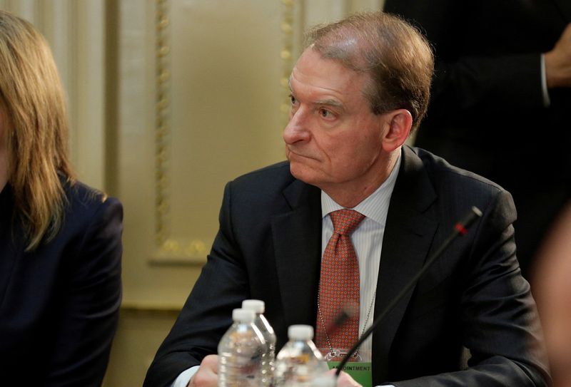 &copy; Reuters. FILE PHOTO: CEO of Patomak Global Partners LLC Paul Atkins takes part in a strategic and policy CEO discussion with U.S. President Donald Trump in the Eisenhower Execution Office Building in Washington, U.S., April 11, 2017.  REUTERS/Joshua Roberts/File P