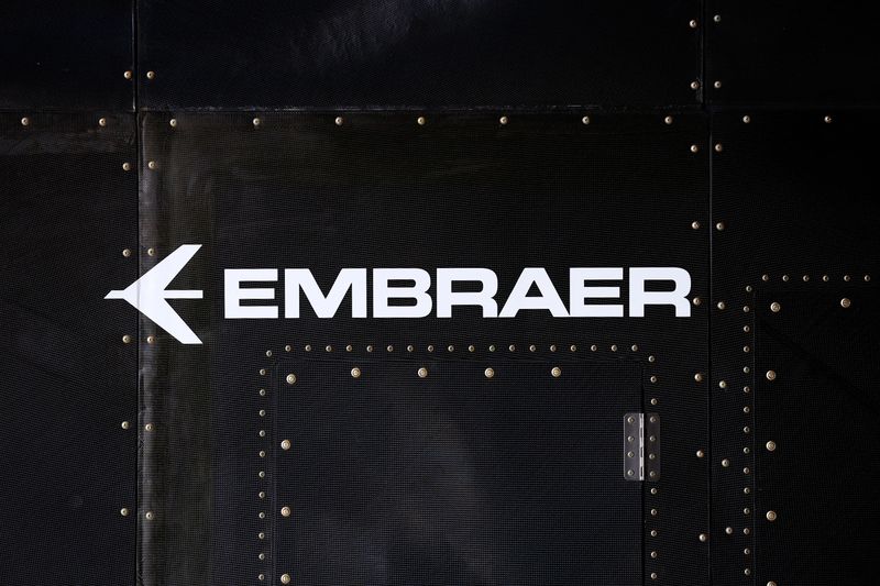 &copy; Reuters. FILE PHOTO: The Embraer logo is seen at the full-scale prototype of an electric vertical take-off and landing (eVTOL) aircraft developed by Eve Air Mobility, an Embraer group company, as it is presented for the first time in Gaviao Peixoto, Brazil July 3,