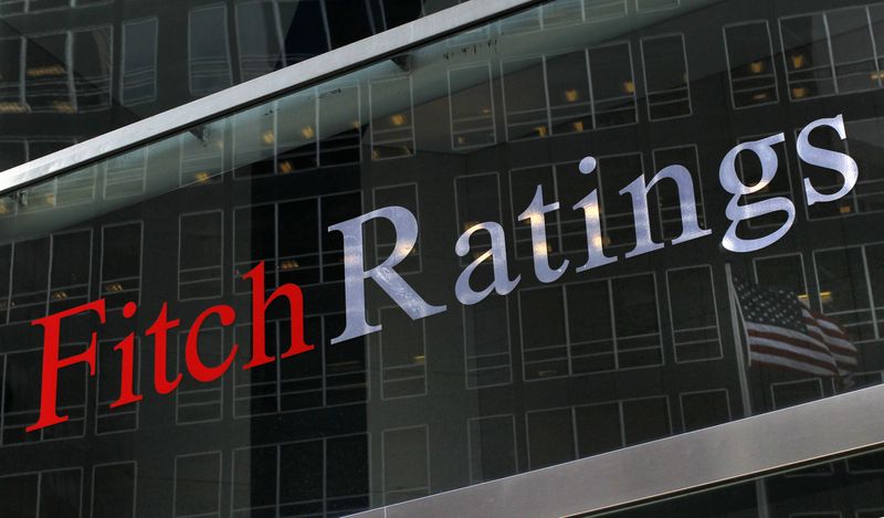 &copy; Reuters. FILE PHOTO: A flag is reflected on the window of the Fitch Ratings headquarters in New York February 6, 2013. REUTERS/Brendan McDermid/File Photo