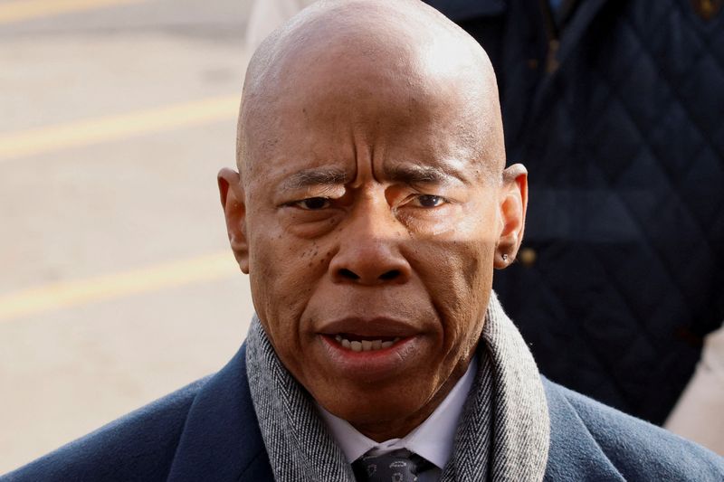 © Reuters. FILE PHOTO: New York Mayor Eric Adams speaks on the day Luigi Mangione, the suspect in the murder of UnitedHealth Group executive Brian Thompson, arrives at a helicopter pad after being extradited from Pennsylvania, in New York, U.S., December 19, 2024. REUTERS/Eduardo Munoz/File Photo