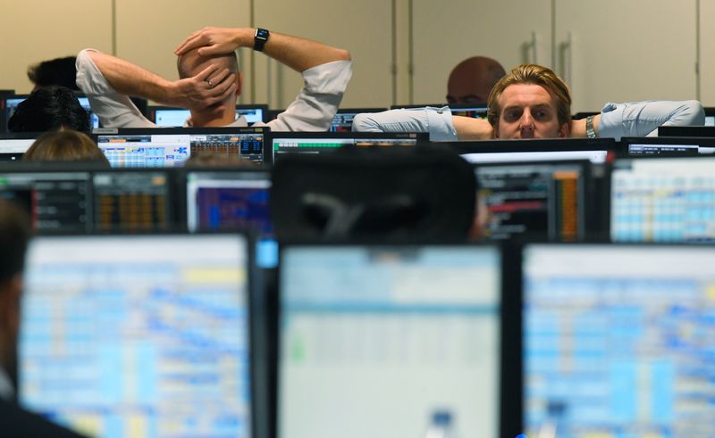 &copy; Reuters. FILE PHOTO: Traders at BGC Partners look at screens in London, Britain, November 9, 2016. REUTERS/Toby Melville/File photo