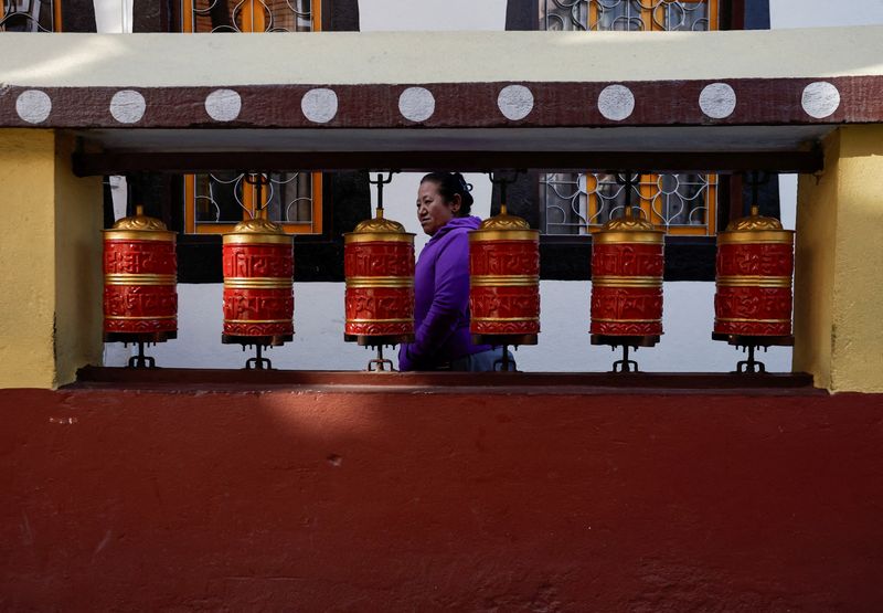 &copy; Reuters. A Tibetan woman in Nepal circles a monastery as she offers prayer in memory of those killed in the recent earthquake, at the Tibetan Refugee Camp in Lalitpur, Nepal January 8, 2025. REUTERS/Navesh Chitrakar/File Photo