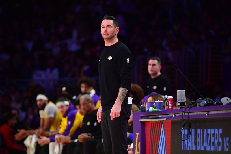 &copy; Reuters. FILE PHOTO: Dec 31, 2024; Los Angeles, California, USA; Los Angeles Lakers head coach JJ Redick watches game action against the Cleveland Cavaliers during the first half at Crypto.com Arena. Mandatory Credit: Gary A. Vasquez-Imagn Images/File photo