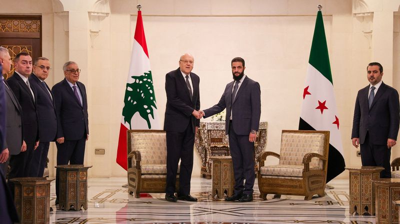 © Reuters. Lebanon's caretaker Prime Minister Najib Mikati meet with Syria's de facto leader Ahmed al-Sharaa in Damascus, Syria, January 11, 2025.  Hayat Tahrir Al-Sham/Handout via REUTERS