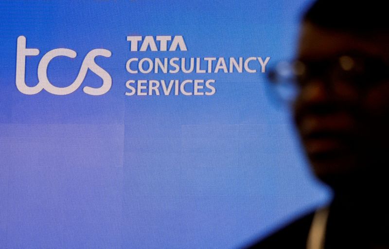 © Reuters. FILE PHOTO: A man walks past the Tata Consultancy Services (TCS) logo before a news conference announcing the company's quarterly results in Mumbai, India, January 11, 2024. REUTERS/Francis Mascarenhas/File Photo