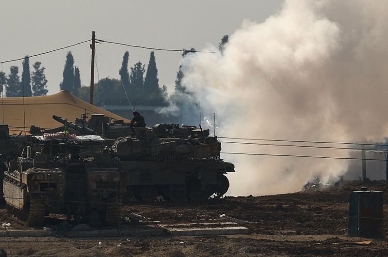 &copy; Reuters. An Israeli soldier sits on top of a tank at a camp, amid the ongoing conflict between Israel and Hamas, near the Israel-Gaza border, in Israel, January 12, 2025. REUTERS/Kai Pfaffenbach