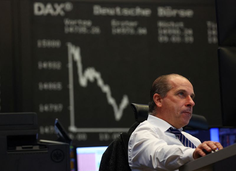 &copy; Reuters. FILE PHOTO: A stock broker sits in front of the share price index DAX graph at the stock exchange in Frankfurt, Germany, March 16, 2023. REUTERS/Kai Pfaffenbach/ File Photo