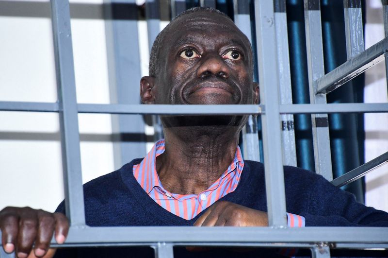 &copy; Reuters. FILE PHOTO: Opposition leader Kizza Besigye stands in a steel dock at the Uganda Military General Court Martial in Makindye, a suburb of Kampala, Uganda December 2, 2024. REUTERS Abubaker Lubowa/File Photo