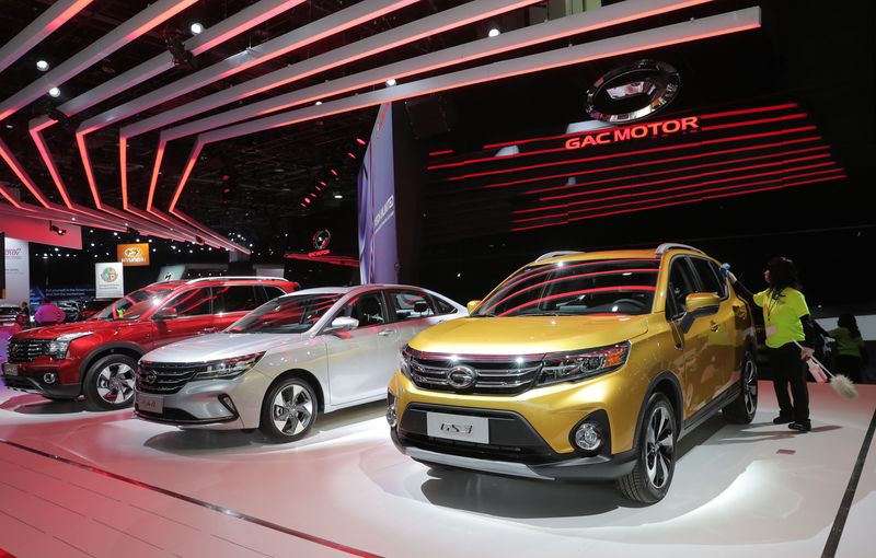 &copy; Reuters. FILE PHOTO: A worker cleans a vehicle made by Chinese automobile maker GAC at the company's display during the North American International Auto Show in Detroit, Michigan, U.S., January 14, 2019. REUTERS/Rebecca Cook/File Photo