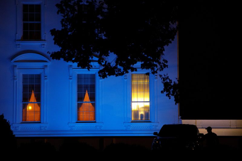 &copy; Reuters. FILE PHOTO: The North Portico of the White House is illuminated in blue for Autism Awareness Day, in Washington, U.S. April 2, 2020. REUTERS/Tom Brenner/File Photo