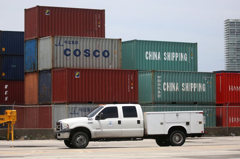 &copy; Reuters. FILE PHOTO: A truck drives past Cosco and China Shipping shipping containers in the Port of Miami in Miami, Florida, U.S., May 19, 2016.  REUTERS/Carlo Allegri/File Photo