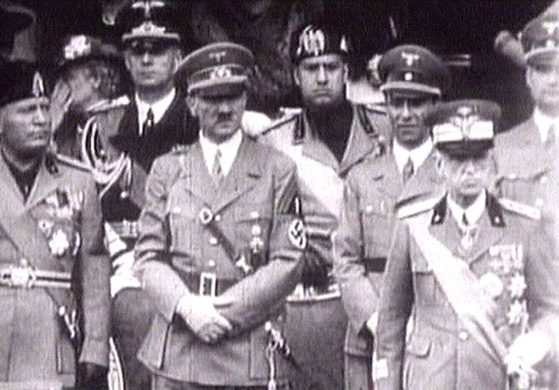 &copy; Reuters. FILE PHOTO: King Victor Emanuel III, (R) Adolf Hitler (C) and Benito Mussolini (L) watch fascist troops march past from a balcony in central Rome in this 1941 television file footage/File Photo