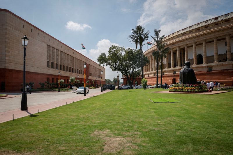 © Reuters. FILE PHOTO: A view shows India's new (L) and old parliament buildings during the first day of the five-day long special session in New Delhi, India, September 18, 2023. REUTERS/Adnan Abidi/File Photo