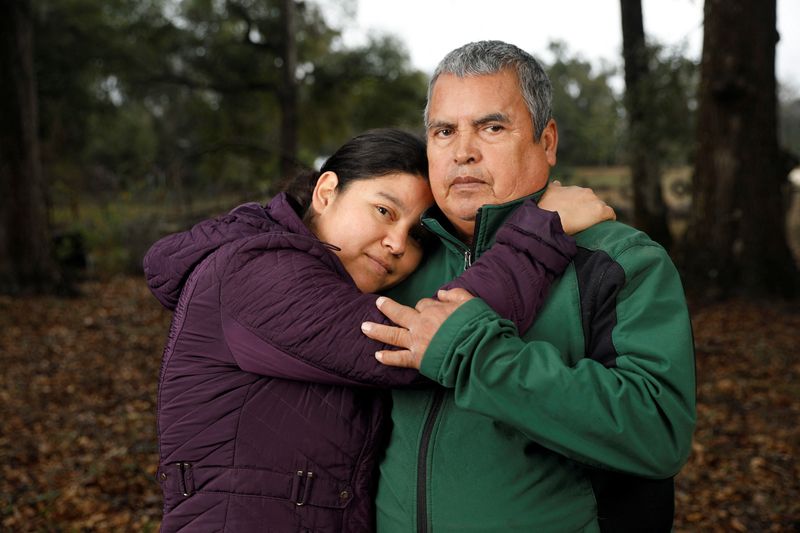 &copy; Reuters. Blanca Figueroa from Guatemala, who has a deportation order dating back to when she first entered the country illegally and asked for asylum in 2016, poses at her home's yard with her husband Severiano Martinez, in Ocala, Florida, U.S. January 13, 2025.  