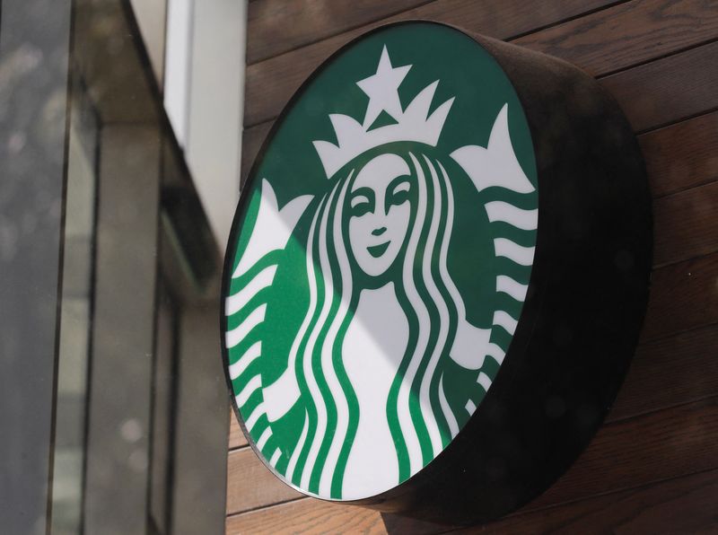 © Reuters. FILE PHOTO: A view shows the logo of an American coffee company Starbucks on a wall outside a coffee shop in Mexico City, Mexico June 17, 2024. REUTERS/Henry Romero/File Photo