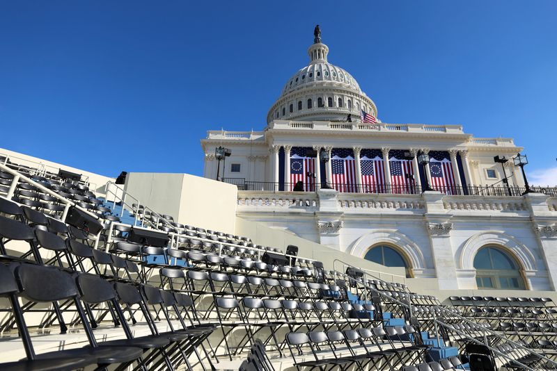 &copy; Reuters. Empty chairs on the inaugural stand are seen on the day it was announced U.S. President-elect Donald Trump's inauguration is being moved indoors due to dangerously cold temperatures expected on Monday, in Washington, U.S., January 17, 2025. REUTERS/Kevin 