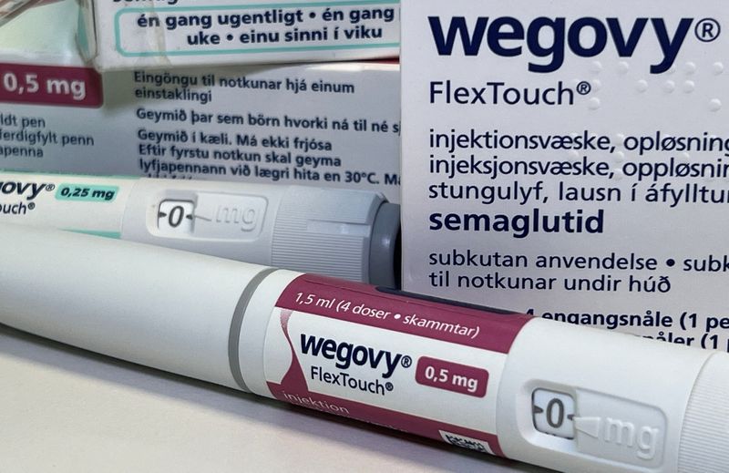 © Reuters. FILE PHOTO: Injection pens and boxes of Novo Nordisk's weight-loss drug Wegovy are shown in this photo illustration in Oslo, Norway, November 21, 2023. REUTERS/Victoria Klesty/Illustration/File Photo