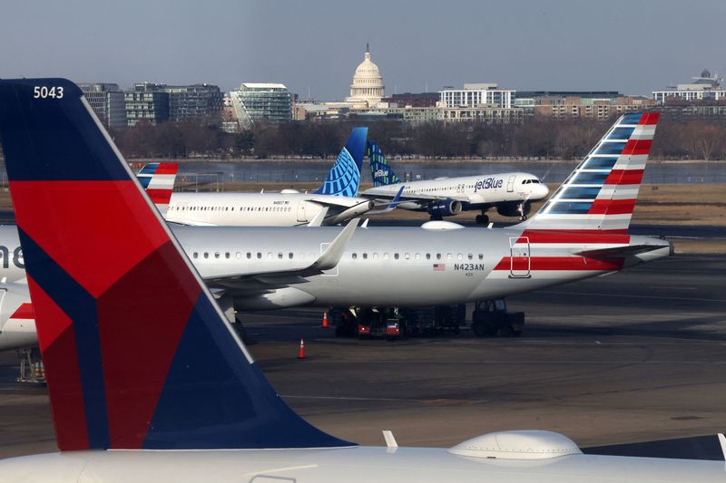 &copy; Reuters. FILE PHOTO: A JetBlue aircraft lands under the DC skyline featuring the U.S. Capitol building, near United Airlines, American Airlines and Delta Airlines aircraft on the tarmac at Ronald Reagan Washington National Airport in Arlington, Virginia, U.S. Janu