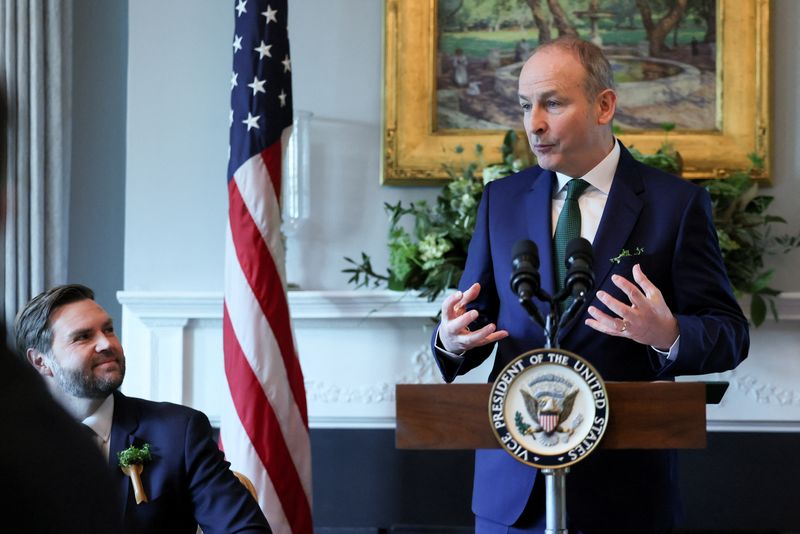© Reuters. Irish Taoiseach (Prime Minister) Micheal Martin delivers remarks next to U.S. Vice President JD Vance during Martin’s visit at the vice president’s residence for breakfast, ahead of St. Patrick’s Day, in Washington, D.C., U.S., March 12, 2025. REUTERS/Leah Millis