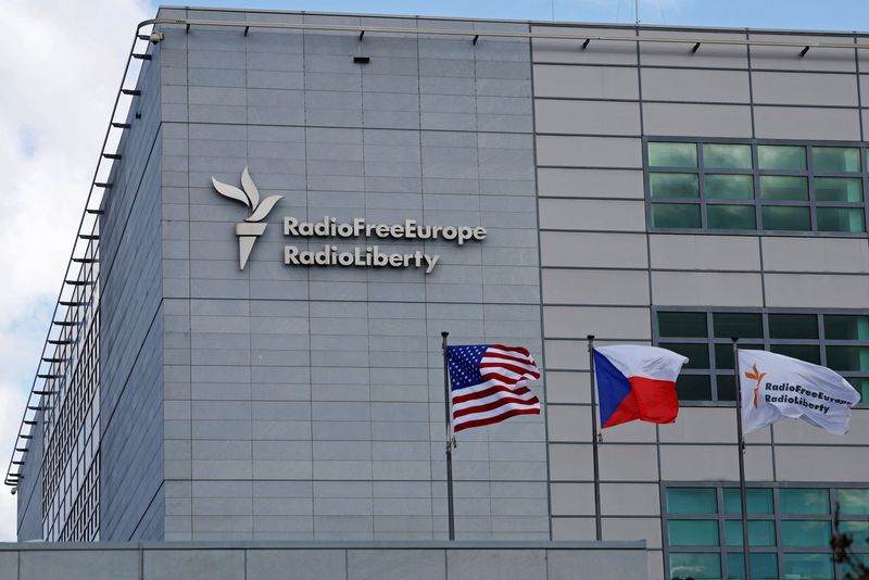 &copy; Reuters. FILE PHOTO: A sign and flags are shown at the headquarters of Radio Free Europe/Radio Liberty in Prague, Czech Republic, March 17, 2025. REUTERS/David W Cerny/File Photo