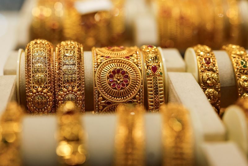 Gold set for third weekly gain as investors seek safe haven