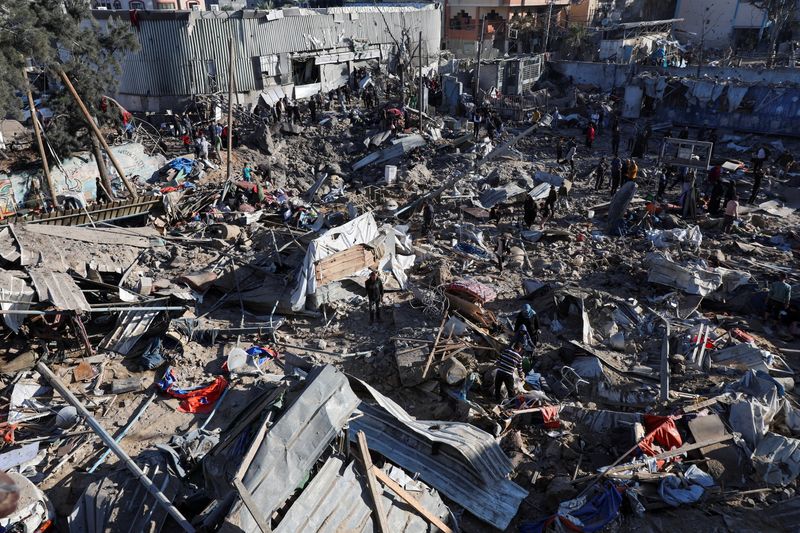 Israeli strikes kill 13 in Gaza school housing displaced families, medics say