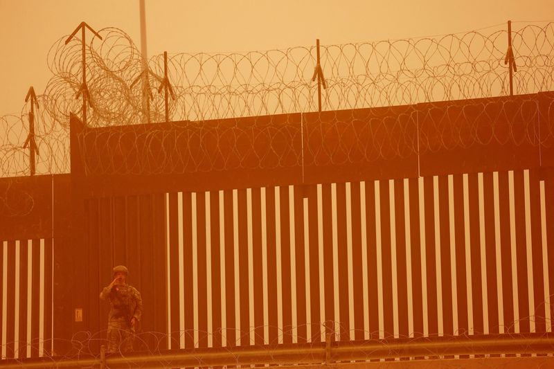 US judge dismisses charges against migrants caught in military zone