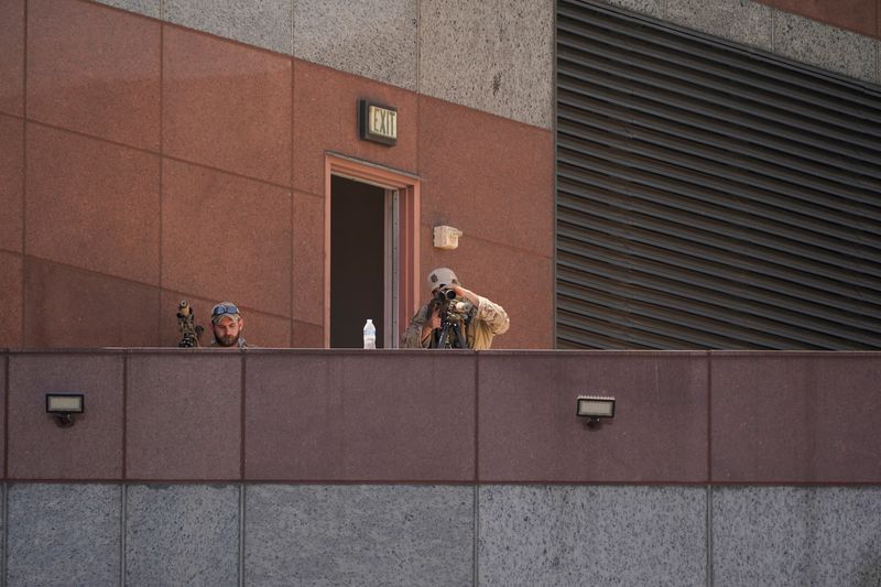 &copy; Reuters. Members of a sniper team operate at the Edward R. Roybal Federal Building after days of protests against federal immigration sweeps and the deployment of the California National Guard and U.S. Marines, in downtown Los Angeles, California, U.S., June 10, 2